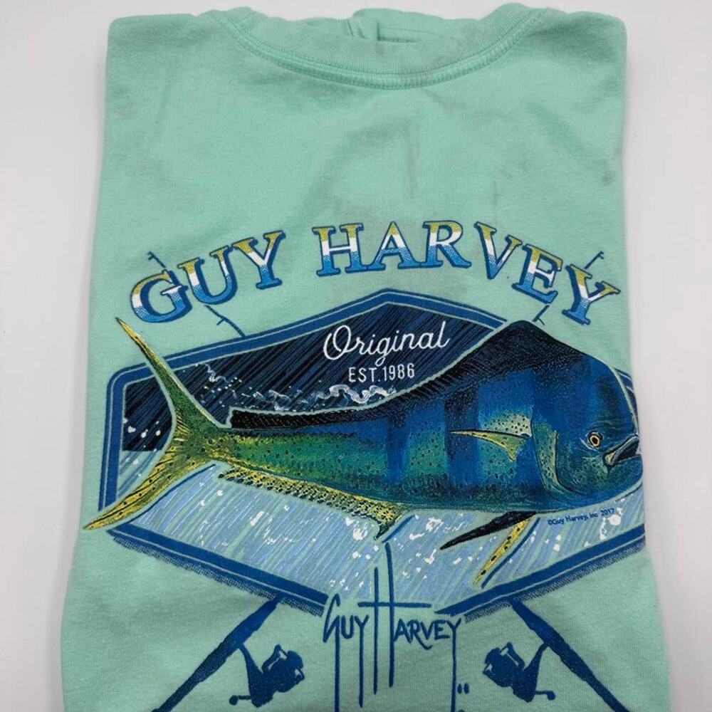 Guy Harvey shirt stains all over. Tagged size large fits like a medium